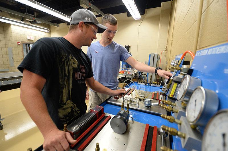 Tech Ed student using machinery.